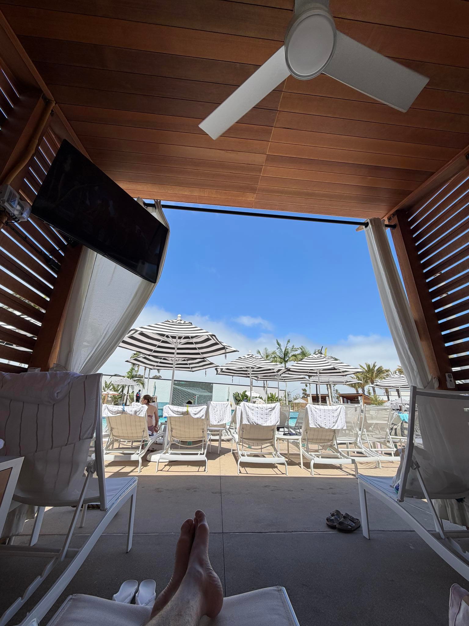 Jim Carter under a cabana