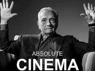 Black-and-white image of Martin Scorsese raising his hand in the air with text ABSOLUTE CINEMA